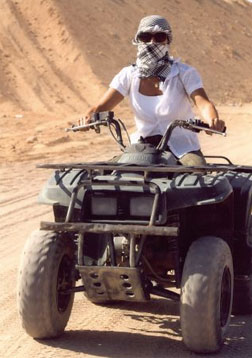 Photo of Person Riding a Quad Bike